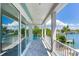 Balcony with water view and white railings at 635 115Th Ave, Treasure Island, FL 33706