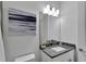 Simple bathroom with single vanity and granite countertop at 635 115Th Ave, Treasure Island, FL 33706
