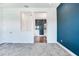 Bedroom with grey carpet and an open view of the bathroom at 635 115Th Ave, Treasure Island, FL 33706