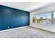 Bright bedroom with water views and a dark accent wall at 635 115Th Ave, Treasure Island, FL 33706