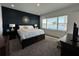 Spacious bedroom featuring water views and dark accent wall at 635 115Th Ave, Treasure Island, FL 33706