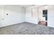 Spacious bedroom with grey carpet and en-suite bathroom at 635 115Th Ave, Treasure Island, FL 33706