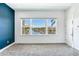 Bedroom with water views and a dark accent wall at 635 115Th Ave, Treasure Island, FL 33706