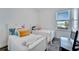 Cozy bedroom with twin beds and water view at 635 115Th Ave, Treasure Island, FL 33706