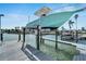 Covered boat lift and spacious dock at 635 115Th Ave, Treasure Island, FL 33706