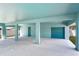 Covered patio with garage access and storage at 635 115Th Ave, Treasure Island, FL 33706