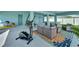 Covered patio with exercise equipment and seating at 635 115Th Ave, Treasure Island, FL 33706