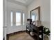 Welcoming entryway with console table and mirror at 635 115Th Ave, Treasure Island, FL 33706