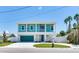 Two-story waterfront home with teal exterior at 635 115Th Ave, Treasure Island, FL 33706