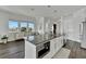 Open concept kitchen with island and built in microwave at 635 115Th Ave, Treasure Island, FL 33706