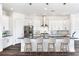 Spacious kitchen featuring white cabinets and a large island at 635 115Th Ave, Treasure Island, FL 33706