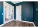 Modern office with blue walls and wood flooring at 635 115Th Ave, Treasure Island, FL 33706