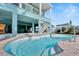 Inviting pool area with brick patio and a view of the canal at 635 115Th Ave, Treasure Island, FL 33706