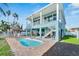 Charming pool with brick patio and lounge chairs at 635 115Th Ave, Treasure Island, FL 33706