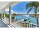 Stunning waterfront view with boat dock and pool access from balcony at 635 115Th Ave, Treasure Island, FL 33706