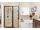 Bathroom with walk-in shower and a separate tub at 6650 Current Dr, Apollo Beach, FL 33572