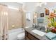 Clean bathroom with tub shower combo, granite vanity, and updated fixtures at 6650 Current Dr, Apollo Beach, FL 33572