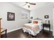 Charming bedroom with wood floors and a comfortable bed at 6650 Current Dr, Apollo Beach, FL 33572