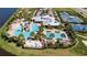 Aerial view of community pool area with lap pool and playground at 6650 Current Dr, Apollo Beach, FL 33572