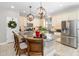 Modern kitchen with granite countertops, stainless steel appliances, and island at 6650 Current Dr, Apollo Beach, FL 33572