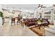 Open floor plan with kitchen and living room, featuring leather sofas at 6650 Current Dr, Apollo Beach, FL 33572