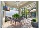 Relaxing screened patio with outdoor seating and ceiling fan at 6650 Current Dr, Apollo Beach, FL 33572