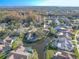 Aerial view of a house on a canal, with a pool and lush landscaping at 1000 Chillum Ct, Safety Harbor, FL 34695