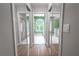Long hallway bathroom with mirrored closets and a view of the Primary bath at 1000 Chillum Ct, Safety Harbor, FL 34695
