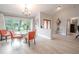 Bright dining room with hardwood floors and access to the front entry at 1000 Chillum Ct, Safety Harbor, FL 34695