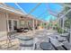 Relaxing screened patio with brick pavers and plenty of seating at 1000 Chillum Ct, Safety Harbor, FL 34695