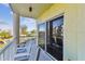 Outdoor balcony with seating and partial ocean view at 12000 Gulf Blvd # 309N, Treasure Island, FL 33706