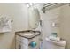 Bathroom with granite vanity and updated fixtures at 12000 Gulf Blvd # 309N, Treasure Island, FL 33706