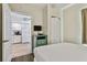 Bedroom with full-size bed and view of kitchen at 12000 Gulf Blvd # 309N, Treasure Island, FL 33706