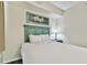 Bedroom with a full-size bed and bedside table at 12000 Gulf Blvd # 309N, Treasure Island, FL 33706