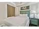 Cozy bedroom with a full-size bed and bedside table at 12000 Gulf Blvd # 309N, Treasure Island, FL 33706