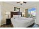 King-size bed, nightstands, and access to balcony at 12000 Gulf Blvd # 309N, Treasure Island, FL 33706