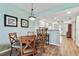 Dining area with a round table and chairs near kitchen at 12000 Gulf Blvd # 309N, Treasure Island, FL 33706