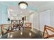 Bright dining area with table and four chairs at 12000 Gulf Blvd # 309N, Treasure Island, FL 33706