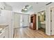 Bright entryway with wood floors and built-in shelving at 12000 Gulf Blvd # 309N, Treasure Island, FL 33706