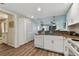Kitchen with white cabinets, granite countertops, and a view of the bathroom at 12000 Gulf Blvd # 309N, Treasure Island, FL 33706