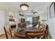 Living room features a sofa, TV, and balcony access at 12000 Gulf Blvd # 309N, Treasure Island, FL 33706