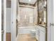 Small bathroom with tub, shower, and updated vanity at 1340 Bayshore Blvd # 407, Dunedin, FL 34698