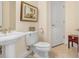 Clean and modern bathroom with pedestal sink and toilet at 1340 Bayshore Blvd # 407, Dunedin, FL 34698