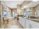 Large bathroom with double vanity and soaking tub at 1340 Bayshore Blvd # 407, Dunedin, FL 34698