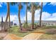 Brick walkway offering scenic bay views and relaxing seating at 1340 Bayshore Blvd # 407, Dunedin, FL 34698
