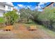 Landscaped pathway with benches in a quiet community setting at 1340 Bayshore Blvd # 407, Dunedin, FL 34698