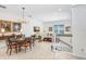 Open concept dining room with adjacent living space at 1340 Bayshore Blvd # 407, Dunedin, FL 34698