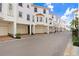 Row of townhouses with attached garages and a paved driveway at 1340 Bayshore Blvd # 407, Dunedin, FL 34698