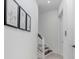 Clean and bright hallway featuring a staircase and elevator access at 1340 Bayshore Blvd # 407, Dunedin, FL 34698