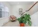 Charming sitting area with a comfortable armchair and large plant at 1340 Bayshore Blvd # 407, Dunedin, FL 34698